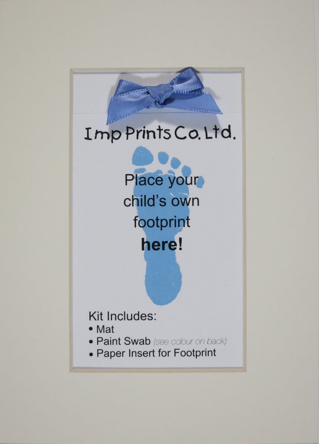 Imp Prints Co keepsakes for parents Plain Ivory Mat with a blue bow on the paper near the top. An insert with an image of a blue footprint says "Place your child's own footprint here, kit includes Mat, Paint Swab, Paper