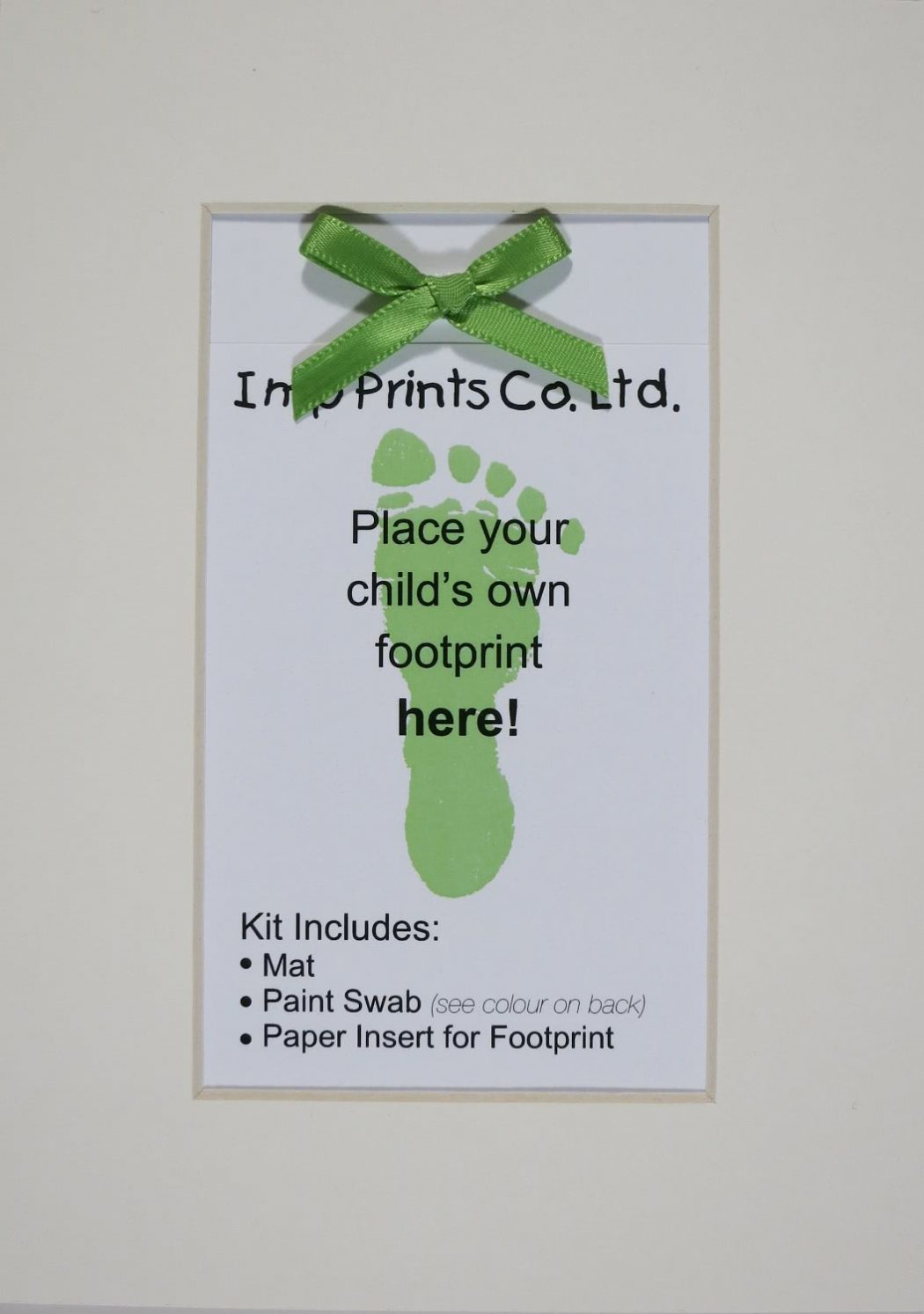 Imp Prints Co keepsakes for parents Plain Ivory Mat with a green bow on the paper near the top. An insert with an image of a greem footprint says "Place your child's own footprint here, kit includes Mat, Paint Swab, Paper