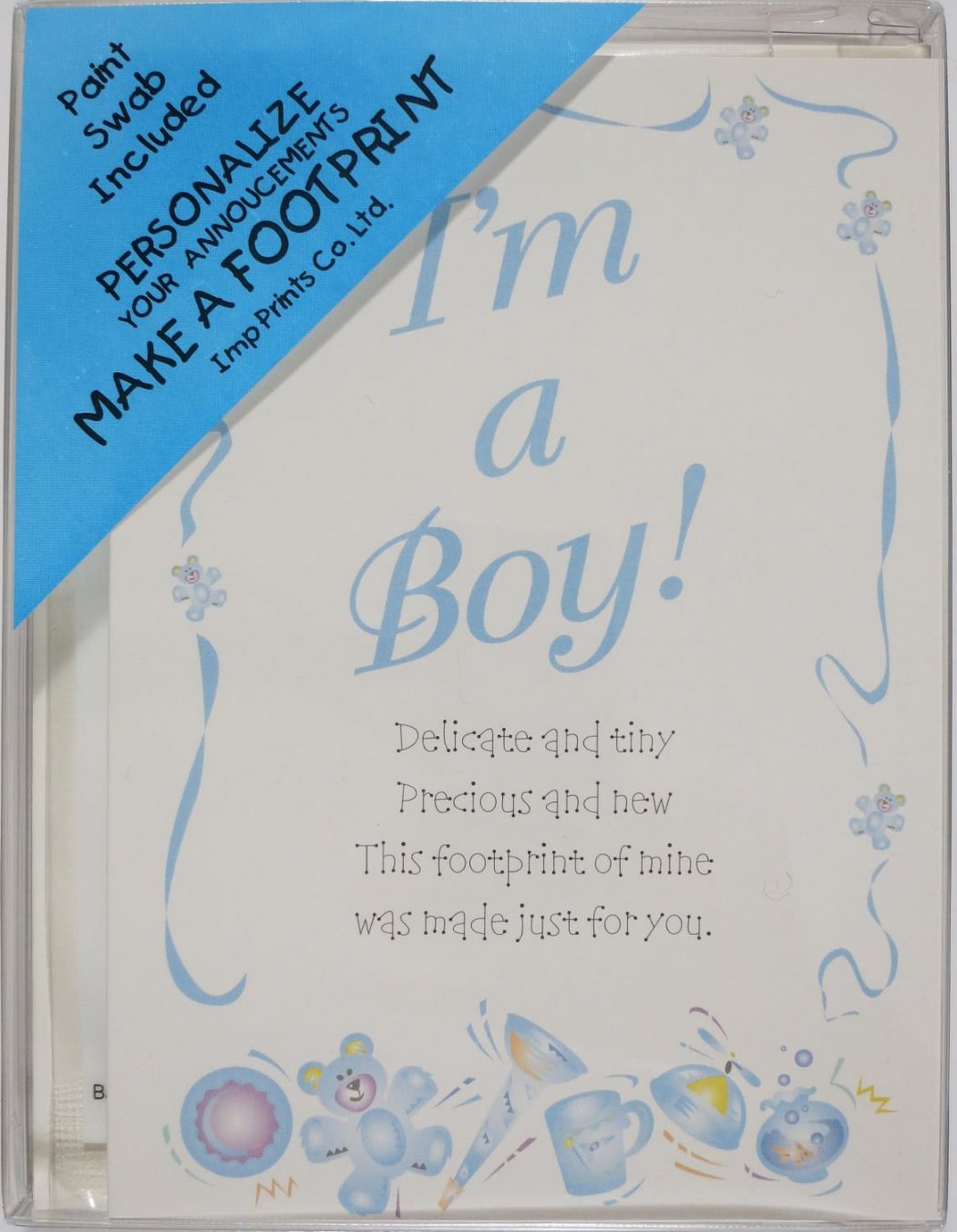A plastic box containing Imp Prints Co Birth Announcement Cards for Boys. Inside a whimsical purple border it says "I'm a Boy!" Underneath is a poem "Our precious baby, Delicate and tiny, Precious and new, This footprint of mine was made just for you