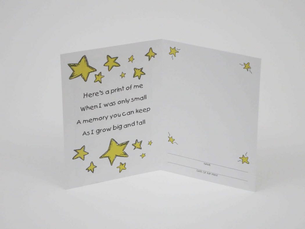 Inside of card has whimsical yellow stars, a place for a print and the lines "hear's a print of me, when I was only small, a memory you can keep, as I grow big and tall. These make nice keepsakes for parents